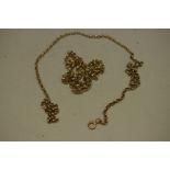 Two gold chains, the clasps stamped 9ct, 23.7g.