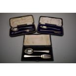 Three cased silver christening fork & spoon sets, 132g.