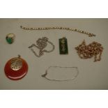 A green jade set gold ring, stamped 14k; together with two Oriental jade pendants; and four other