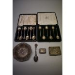 Two cased sets of six silver coffee spoons,one by Mappin & Webb, Sheffield 1922; the other by Arthur