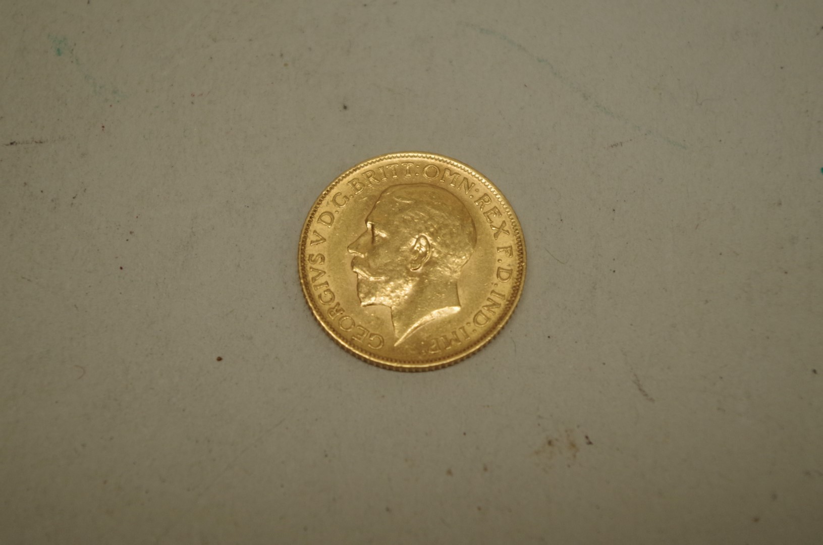 A George V 1912 gold sovereign.