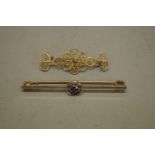 A sapphire gold bar brooch, stamped 15ct; together with an unmarked yellow metal filigree bar