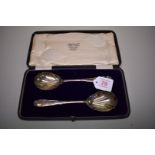 A cased pair of serving spoons, by Josiah Williams & Co, London 1919, 95g.