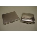 Two silver engine turned cigarette cases, 213g all in.