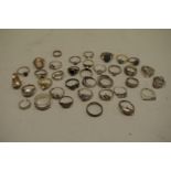A collection of silver and other metal rings.