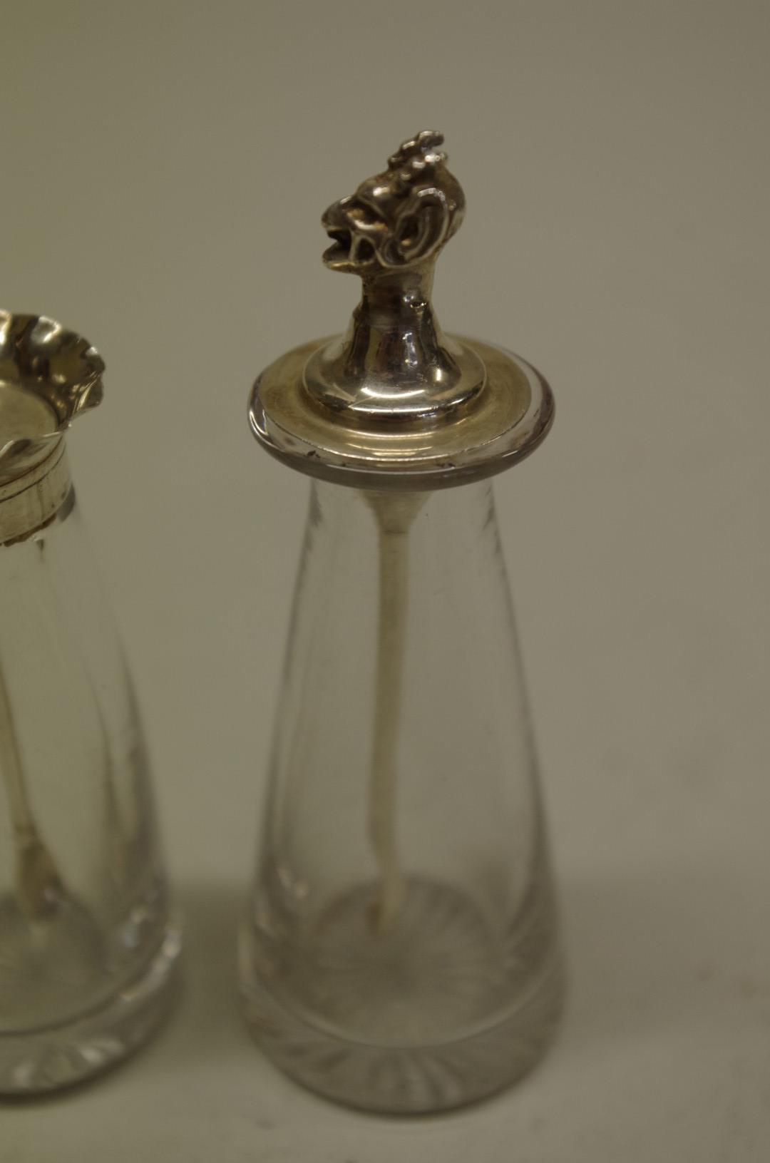 A silver devil cayenne pepper spoon, by Hukin & Heath, Birmingham 1929, 11g, in glass flask; - Image 2 of 3