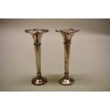 A pair of .800 silver trumpet vases, 13cm high, weighted bases.