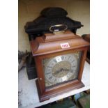 A slate mantel clock, 38cm high; together with another reproduction mantel clock.