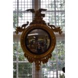 A 19th century gilt wood framed convex wall mirror, total height 95cm.