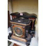 Two ebonized mantel clocks, largest 39cm wide.