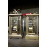 Two brass carriage timepieces, height of largest including handle 14.5cm, each with winding key.