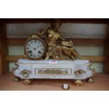 A late 19th century alabaster and gilt metal figural mantel clock, the bell striking movement