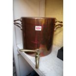 A copper water boiler and cover, with brass tap, 24cm high.