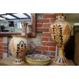 Five items of continental slip glazed pottery, largest 70cm high.