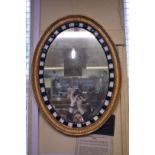 An old Irish style gilt and faceted bead oval wall mirror, 70 x 52.5cm.