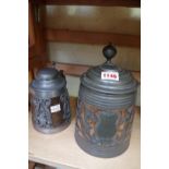 Two Swedish pewter mounted wood tankards, largest 22cm high.