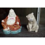 A Chinese pottery Buddha, 13.5cm high; together with a Lladro bear, 11.5cm high.