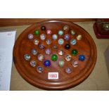 A set of thirty two mid 19th century German glass marbles, to include: mica; transitional; and