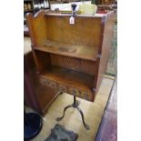 An unusual early 20th century oak and steel tripod bookcase Canterbury, the drawers with