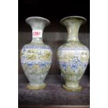 A pair of Royal Doulton stoneware vases, 19cm high.