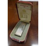 A Dunhill 'Rollagas' electroplated lighter, boxed and with instructions.