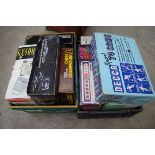 Nine vintage computer games consoles, and similar, each boxed.