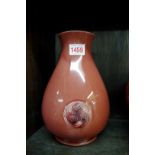 A William Moorcroft Red Famminian vase, for Liberty & Co, incised signature, 23cm high.