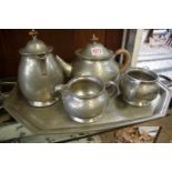 A Liberty Tudric pewter four piece tea set and tray, No.01075, the tray 53cm wide, (the tray