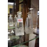 A pair of Art Deco clear and frosted glass scent bottles and stoppers, 25cm high.