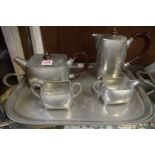 A Liberty Warric hammered pewter four piece tea set and tray, Nos.5065 and 6092, the tray 51cm wide.