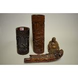 Two Chinese carved bamboo vases, largest 32cm high; together with another carved bamboo boat,