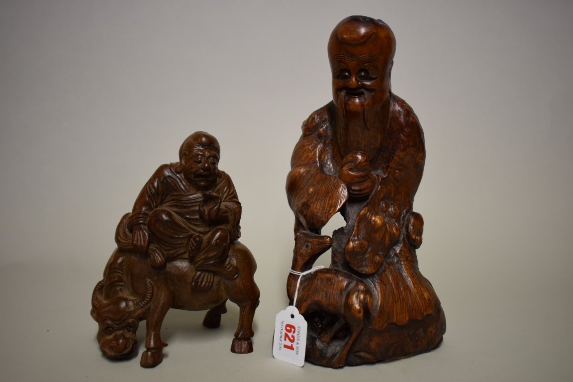 A Chinese carved rootwood figure group, Qing, 26cm high; together with another Chinese carved bamboo