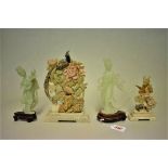 Two Chinese celadon jadeite figures of Guanyin, largest 18.5cm high, each on wood stand; together