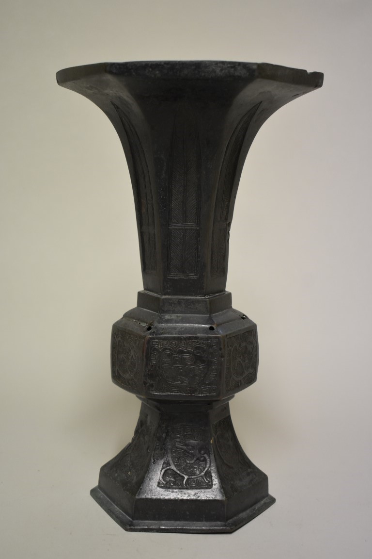 A Chinese bronze archaistic gu vase, 17th/18th century, painted mark to base, 31.5cm high.