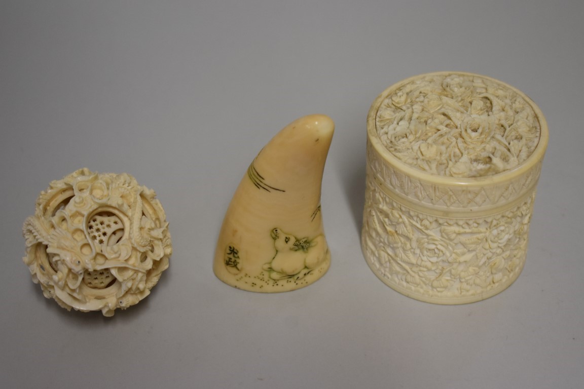 A small group of carved ivory, 19th century, comprising: a circular box and cover, 7cm high; a