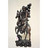 A large Chinese carved wood and metal wire inlaid figure group of a man and deer, 51.5cm high.