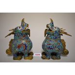 A pair of Chinese cloisonne enamel qilin form vessels and covers, 18cm high. (2)