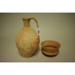 Two antique pottery vessels, comprising: a jug, 27cm high; and a bowl, 14cm diameter. (2)