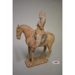 A Chinese terracotta figure of a horse and rider, Tang dynasty, with remains of painted
