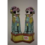 A pair of Chinese famille rose lion dog incense burners, 18th century, 22cm high. (2)