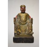 A Sino-Tibetan carved and painted wood seated figure, 30cm high.