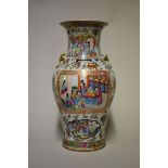 A Chinese Canton famille rose twin handled vase, 19th century, 38cm high, (restoration to rim).