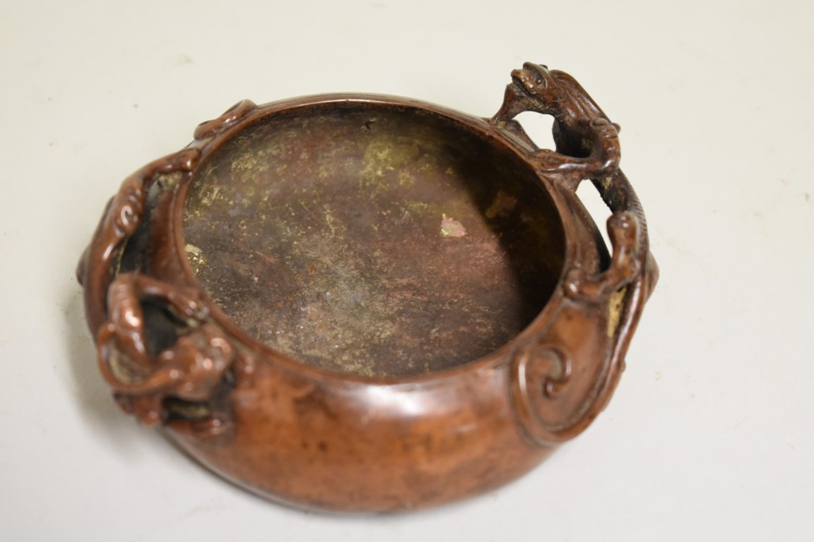 A Chinese bronze twin handled censer, four character seal mark to base, with chilong handles, 12cm