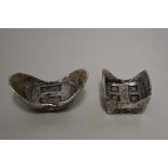 Two Chinese sycee or boat money ingots, largest 8cm wide, 417g. (2)