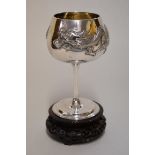 A Chinese silver goblet, by Wang Hing & Co, repousse decorated with a dragon, 15.5cm high, 255g,