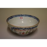 A Chinese famille rose bowl, Qing, painted with panels of figures in gardens, 23.5cm diameter.