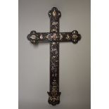 A Chinese hardwood and mother-of-pearl inlaid cross, possibly Macau, 44cm high 24cm wide.