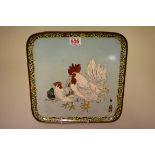 A Japanese cloisonne enamel square plate, decorated with two cockerels, signed, 28cm wide.