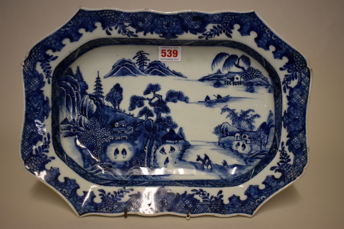 A Chinese blue and white meat plate, late 18th century, of shaped outline, 38.5cm wide.