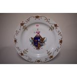 A Chinese famille rose armorial charger, Qianlong, 42cm diameter, (rim chip and associated